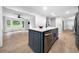 Modern kitchen features a center island, stainless steel appliances and an open floor plan at 3078 Milford Chase Sw, Marietta, GA 30008