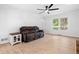 Bright living room with wood-look floors, a large window, and a comfortable seating area at 3078 Milford Chase Sw, Marietta, GA 30008