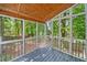 Screened-in porch with wood ceiling and floors and views of wooded backyard at 3078 Milford Chase Sw, Marietta, GA 30008