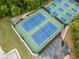 Aerial view of community tennis courts, with parking and green surroundings at 3078 Milford Chase Sw, Marietta, GA 30008