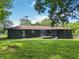Spacious backyard showcases the home's exterior with a lush, green lawn at 3779 Elkridge Dr, Decatur, GA 30032