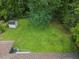Large, flat backyard with lush green grass, mature trees, and a storage shed for outdoor equipment at 3779 Elkridge Dr, Decatur, GA 30032
