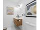 Stylish half bathroom boasts modern fixtures and decorative artwork for an elegant touch at 3779 Elkridge Dr, Decatur, GA 30032