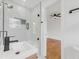Modern bathroom features a glass shower door and sleek vanity with a black faucet at 3779 Elkridge Dr, Decatur, GA 30032