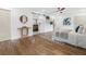 Cozy bedroom boasting hardwood floors, a stylish ceiling fan, and view of the ensuite bathroom at 3779 Elkridge Dr, Decatur, GA 30032