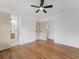 Bright bedroom featuring hardwood floors and a view into the ensuite bathroom at 3779 Elkridge Dr, Decatur, GA 30032