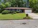 Charming one-story home with updated exterior, a garage, and a neatly landscaped front yard at 3779 Elkridge Dr, Decatur, GA 30032