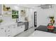 Bright kitchen featuring white cabinetry, stainless steel appliances, and a farmhouse sink at 3779 Elkridge Dr, Decatur, GA 30032