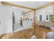 Open-concept kitchen featuring a modern island with stone counter, stainless steel appliances, and hardwood floors at 3779 Elkridge Dr, Decatur, GA 30032
