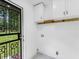 Functional laundry room with white cabinets and a convenient utility sink at 3779 Elkridge Dr, Decatur, GA 30032