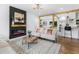 Sunlit living room showcasing modern fireplace, stylish decor and an open concept design at 3779 Elkridge Dr, Decatur, GA 30032