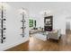 Bright living room featuring modern decor, including a fireplace, wine rack, and hardwood floors at 3779 Elkridge Dr, Decatur, GA 30032