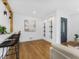 View of the living room with hardwood floors, accent lighting and view into the open kitchen at 3779 Elkridge Dr, Decatur, GA 30032