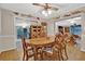Traditional dining room with wood table, chairs, parquet floors and display shelves with decorative items at 200 Dogwood Dr, Canton, GA 30114