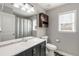 The full bathroom features a large mirror over the vanity, a window for natural light, and a shower and tub combo at 2430 Redbud Meadow Ln, Douglasville, GA 30135
