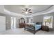Bright main bedroom boasting neutral decor, an ensuite bathroom, and generous closet space at 2430 Redbud Meadow Ln, Douglasville, GA 30135
