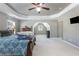 Large primary bedroom featuring a neutral color palette and vaulted ceilings for a bright and airy feel at 2430 Redbud Meadow Ln, Douglasville, GA 30135