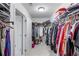 Functional walk-in closet with ample storage shelving and hanging racks for organized wardrobe at 2430 Redbud Meadow Ln, Douglasville, GA 30135