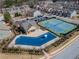 The community clubhouse features a pool and tennis courts, providing recreational amenities for residents at 3318 Sardis Bend Dr, Buford, GA 30519