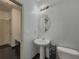 Bathroom featuring a pedestal sink and modern fixtures at 3318 Sardis Bend Dr, Buford, GA 30519