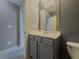 Neutral bathroom with vanity, and toilet with a modern mirror at 3318 Sardis Bend Dr, Buford, GA 30519