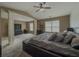 Open primary bedroom space with soft carpeting, modern furniture and stylish ceiling fan at 3318 Sardis Bend Dr, Buford, GA 30519