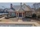 Beautiful clubhouse with stone accents and large windows, creating an inviting community gathering space at 3318 Sardis Bend Dr, Buford, GA 30519