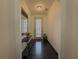 Elegant entryway featuring dark wood floors, stylish console table, mirror, and plenty of natural light at 3318 Sardis Bend Dr, Buford, GA 30519