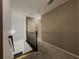 Upstairs hallway featuring carpet and black handrail at 3318 Sardis Bend Dr, Buford, GA 30519