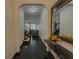 Hallway view with dark wood floors, stylish console table, and open access to the living areas at 3318 Sardis Bend Dr, Buford, GA 30519