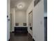 Hallway with a built-in bench, decorative pillows, and mirror at 3318 Sardis Bend Dr, Buford, GA 30519