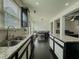 Modern kitchen featuring granite countertops, stainless steel appliances and dark flooring at 3318 Sardis Bend Dr, Buford, GA 30519