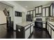 Modern kitchen with black appliances, granite countertops and a central island at 3318 Sardis Bend Dr, Buford, GA 30519