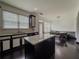 Bright kitchen with granite countertops, black appliances, and a dining area at 3318 Sardis Bend Dr, Buford, GA 30519