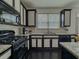 Kitchen showcasing granite countertops, modern appliances, and ample natural light at 3318 Sardis Bend Dr, Buford, GA 30519
