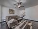 Cozy living room with stylish decor, dark wood floors, neutral walls, and a comfortable sectional sofa at 3318 Sardis Bend Dr, Buford, GA 30519