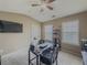 Bright home office space with large windows, desk and vaulted ceiling with fan at 3318 Sardis Bend Dr, Buford, GA 30519