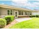 Backyard with green lawn, patio and trimmed shrubbery around the perimeter of the property at 1555 Water Vista Ct # 4102, Cumming, GA 30041