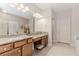 Bathroom featuring granite countertops, double sinks, and a tiled floor at 1555 Water Vista Ct # 4102, Cumming, GA 30041