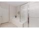 Bathroom featuring a bathtub and a separate glass-enclosed shower at 1555 Water Vista Ct # 4102, Cumming, GA 30041