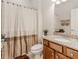 Cozy bathroom with decorative accents and a vanity featuring granite counters at 1555 Water Vista Ct # 4102, Cumming, GA 30041