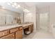 Bathroom featuring granite countertops, double sinks, and a tiled floor at 1555 Water Vista Ct # 4102, Cumming, GA 30041