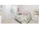 Bright bedroom featuring a patterned bed set, sheer curtains, and neutral walls at 1555 Water Vista Ct # 4102, Cumming, GA 30041