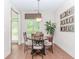 Dining area with wood table, large window, and modern decor at 1555 Water Vista Ct # 4102, Cumming, GA 30041