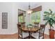 Dining area with wood table, pendant light, and large windows at 1555 Water Vista Ct # 4102, Cumming, GA 30041