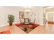 Dining room with hardwood floors, a modern chandelier, and easy access to the home entrance at 1555 Water Vista Ct # 4102, Cumming, GA 30041