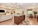 Open kitchen with granite island overlooking living room and breakfast nook at 1555 Water Vista Ct # 4102, Cumming, GA 30041