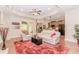 Cozy living room open to the kitchen, featuring hardwood floors and a tray ceiling at 1555 Water Vista Ct # 4102, Cumming, GA 30041