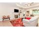 Comfortable living room showcasing a fireplace, hardwood floors, and an open layout at 1555 Water Vista Ct # 4102, Cumming, GA 30041