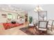Spacious living area adjacent to the dining area, featuring hardwood floors and great natural light at 1555 Water Vista Ct # 4102, Cumming, GA 30041